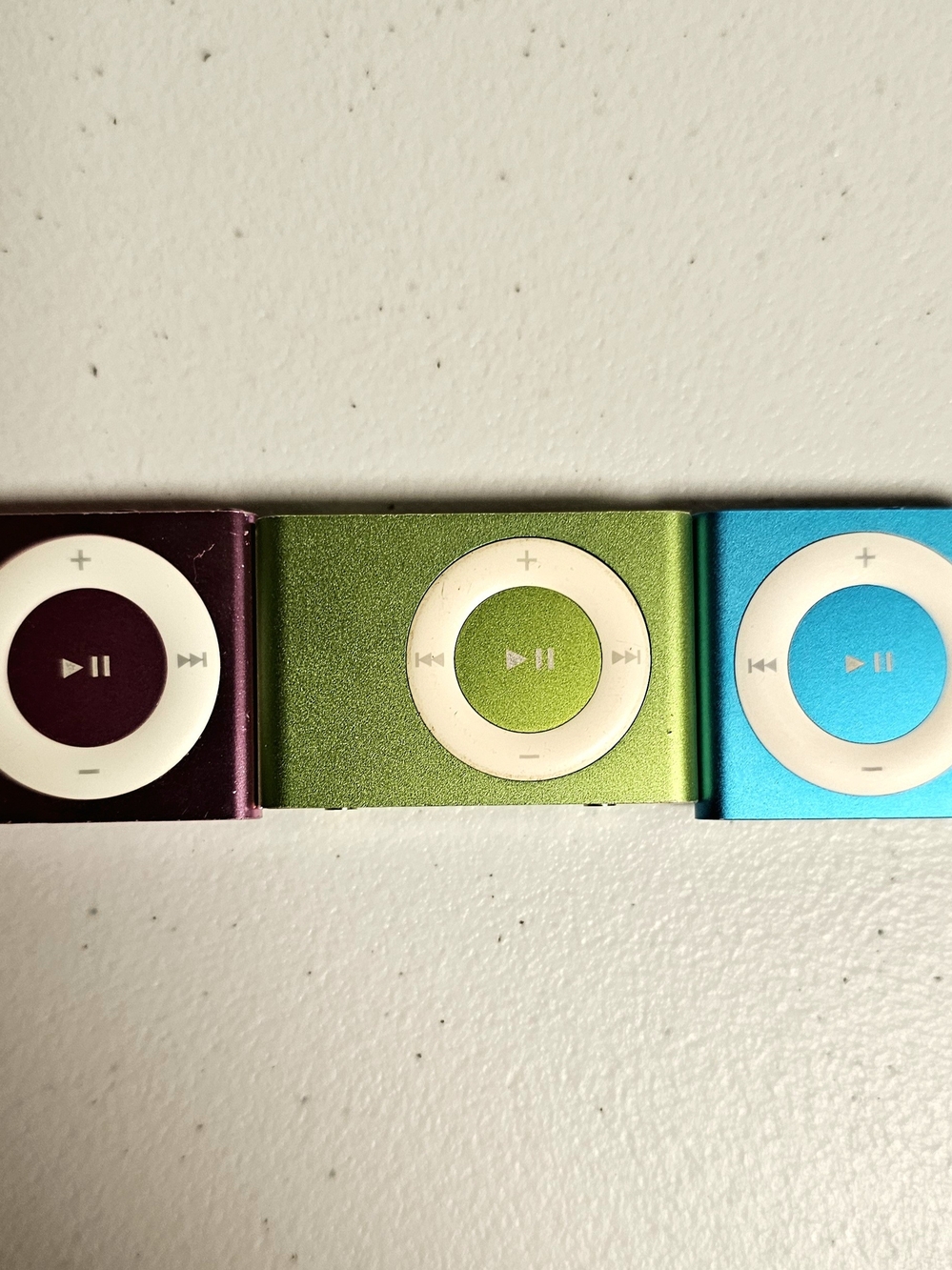 3 iPod shuffles (two 4th gens, one 2nd gen) pink, green, blue